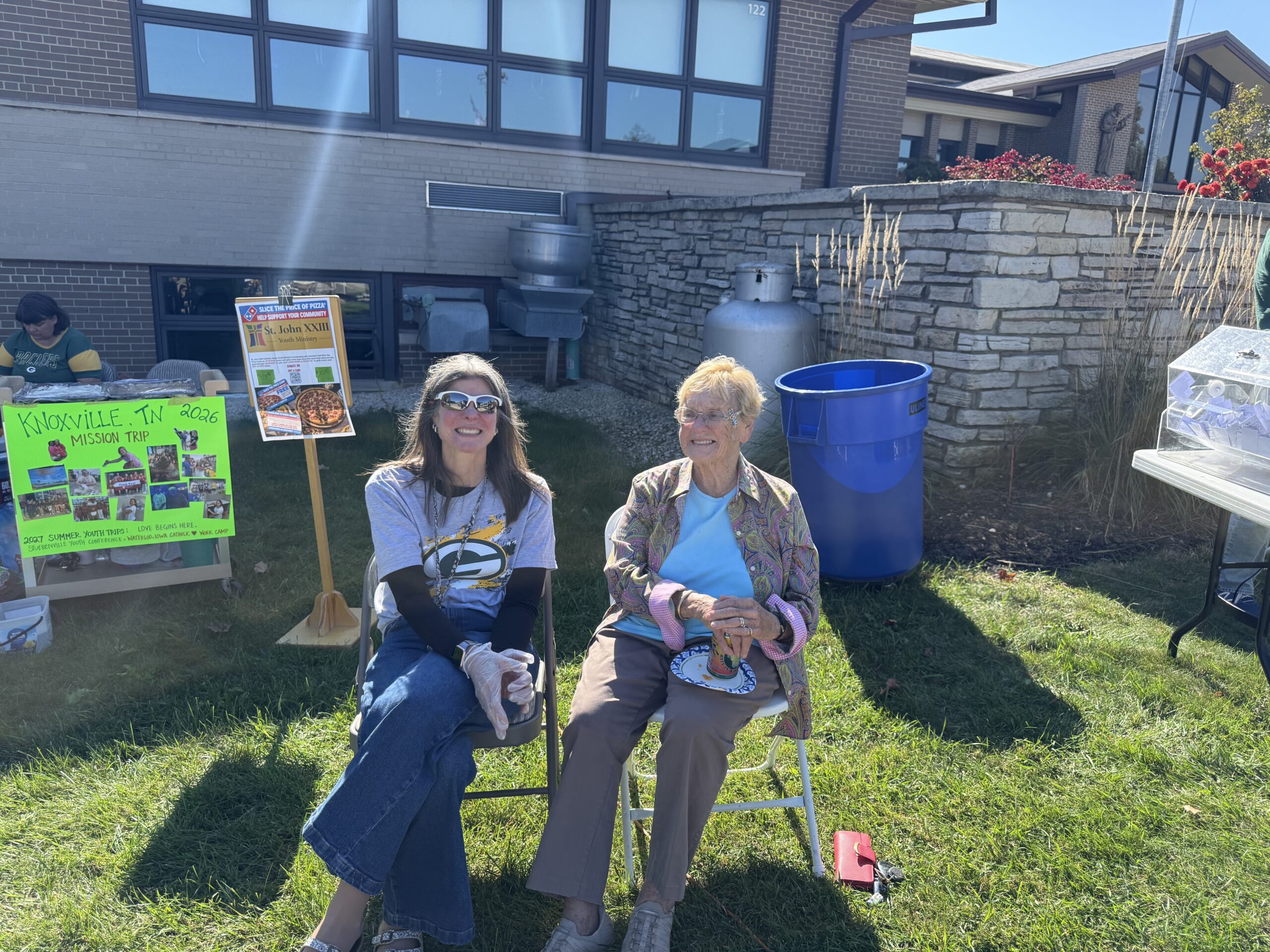 Parish members Dawn Goodno and Barb Roob are enjoying themselves at the Fall Tailgate Party.
